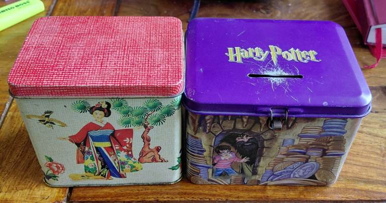 2 small metal storage boxes.