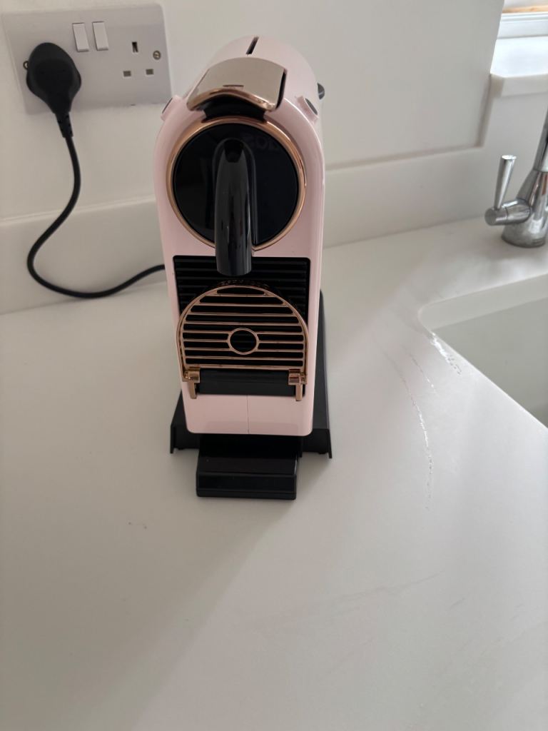 Nespresso pink and rose gold coffee machine 
