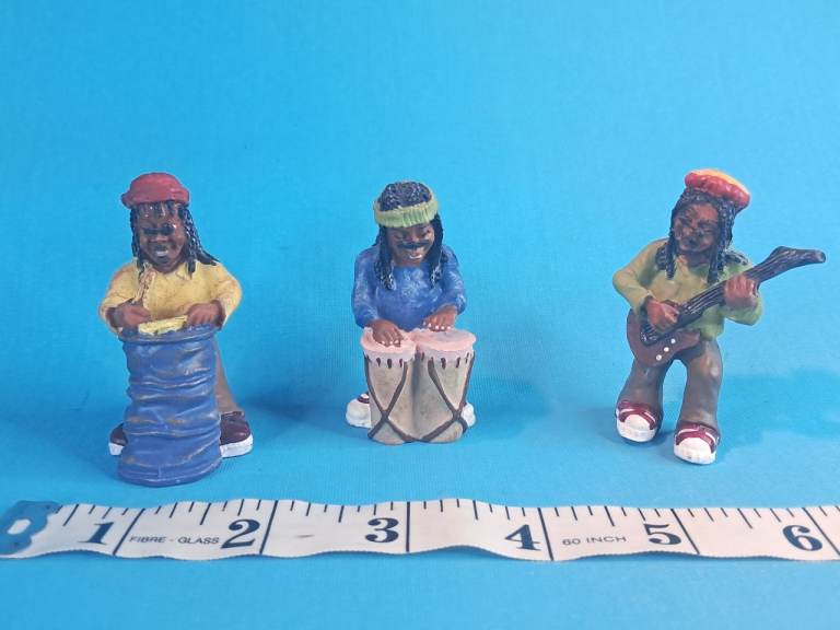 Vintage set of three vintage resin figurines depicting a reggae music band.. 