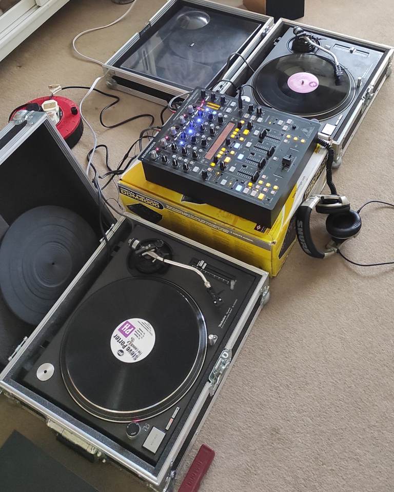 Pair of Technics 1210s turntables, fully working, in flight cases, with carts and styli