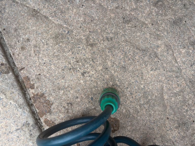 Green Garden Coil Hose with Spray Gun – Good Condition
