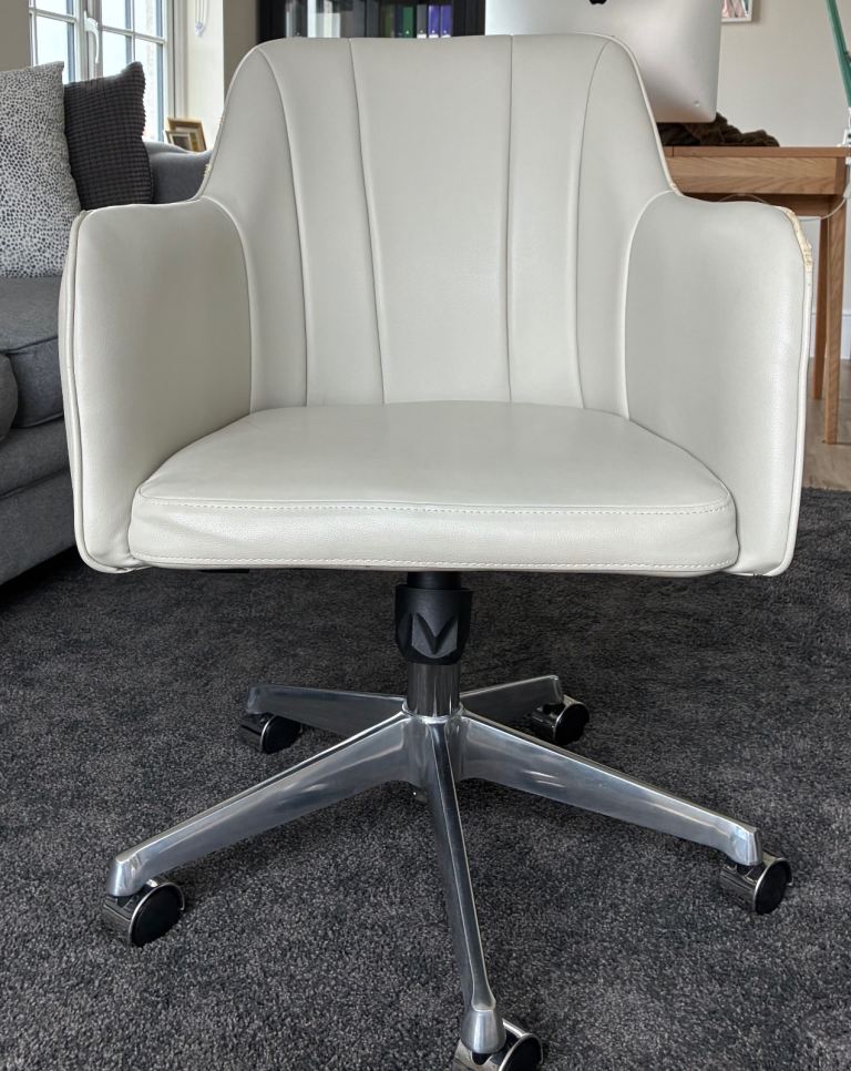 Adjustable leather office chair with rest arms and wheels, beige
