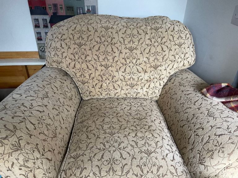 Beautiful Laura Ashley armchair.  Curved arms, front roller wheels. Honey and beige tones.