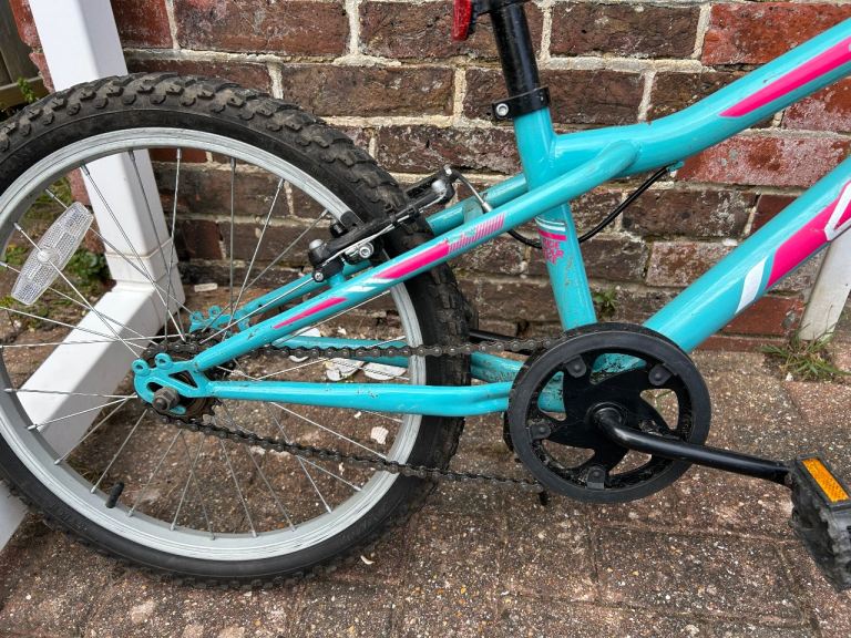 Girls bicycle with crash helmet 