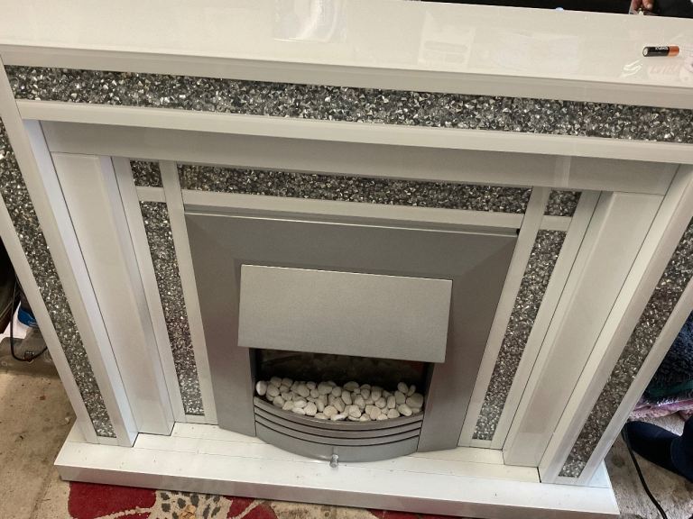 Marble fireplace and electric fire.