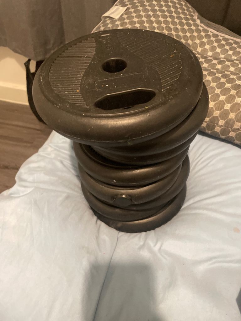 Stack of Black Weight Plates for Home Gym