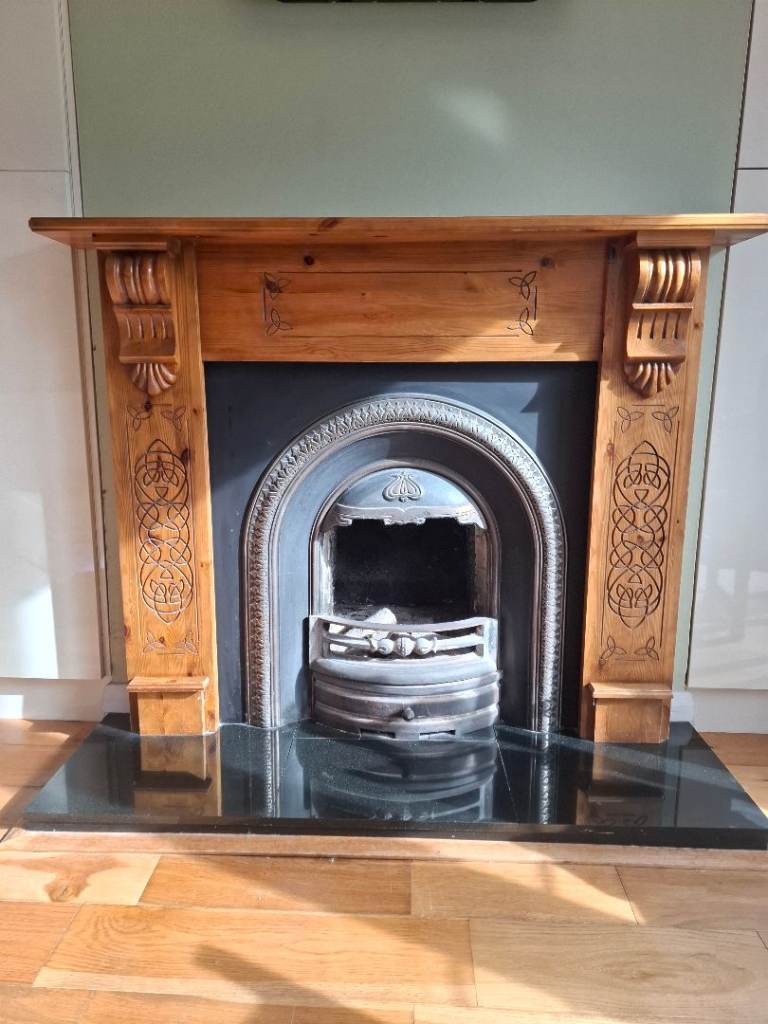 Cast iron fireplace with pine surround 