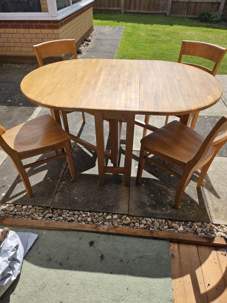 Folding solid oak extendable dining table and 4 chairs
