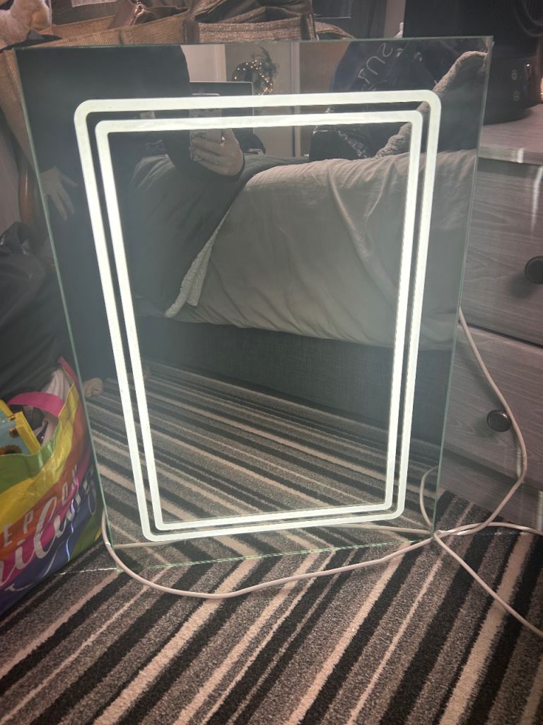 Light up bathroom mirror with shaver point 