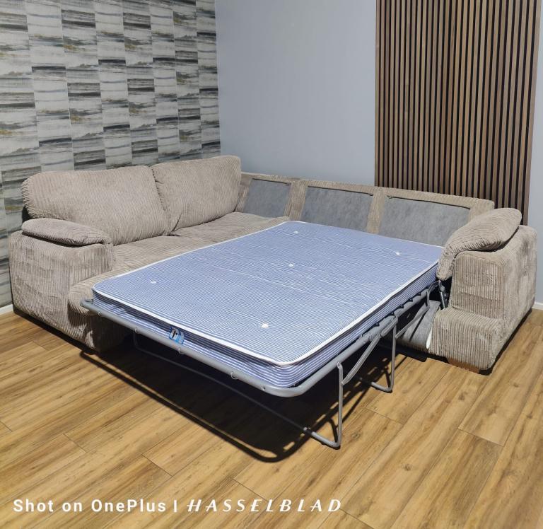 Large beige DFS Corner Sofa Bed  with footstool + free delivery