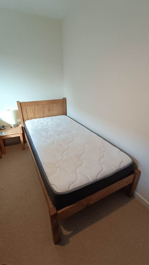 Single bed solid wood frame with a mattress