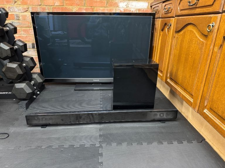 Panasonic 55” TV with soundbar and subwoofer 