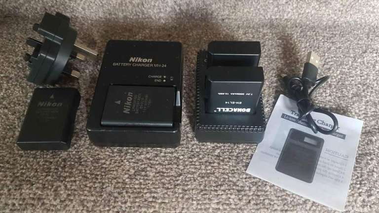 Nikon EN-EL14 lithium-ion DSLR batteries (×2), charger. Plus 2 extra batteries with charger
