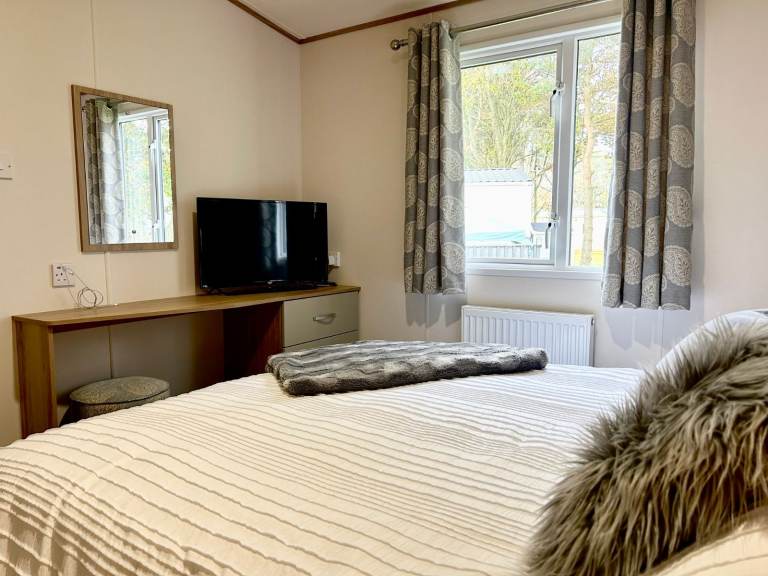 Own a caravan, repaying monthly, near Gt Yarmouth and Lowestoft