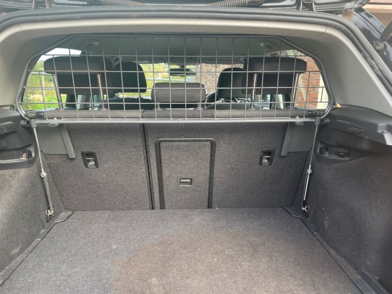 Car dog guard suitable for a Golf