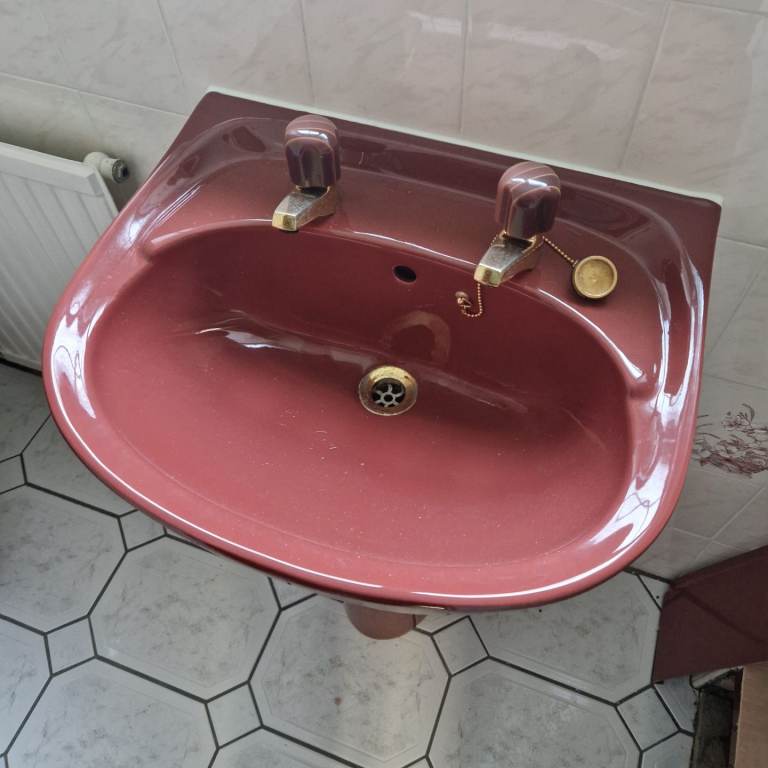 Dark red toilet and sink 