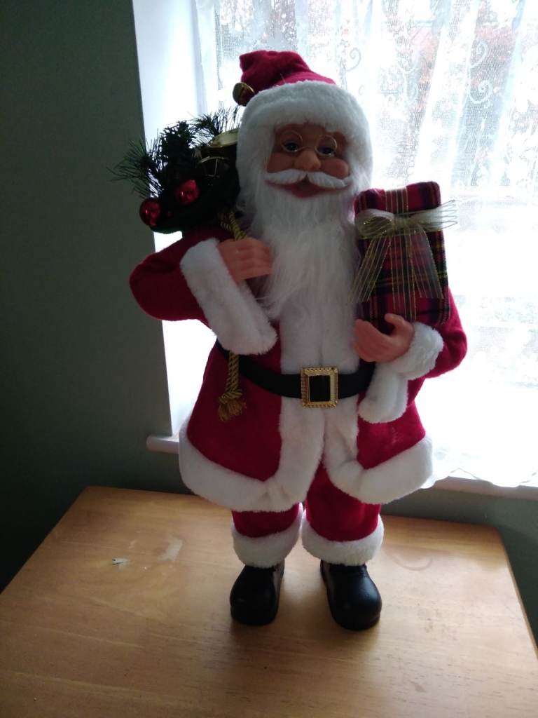 Santa Claus 2 foot tall doll with sack of presents in a red suit and hat, white beard and glasses