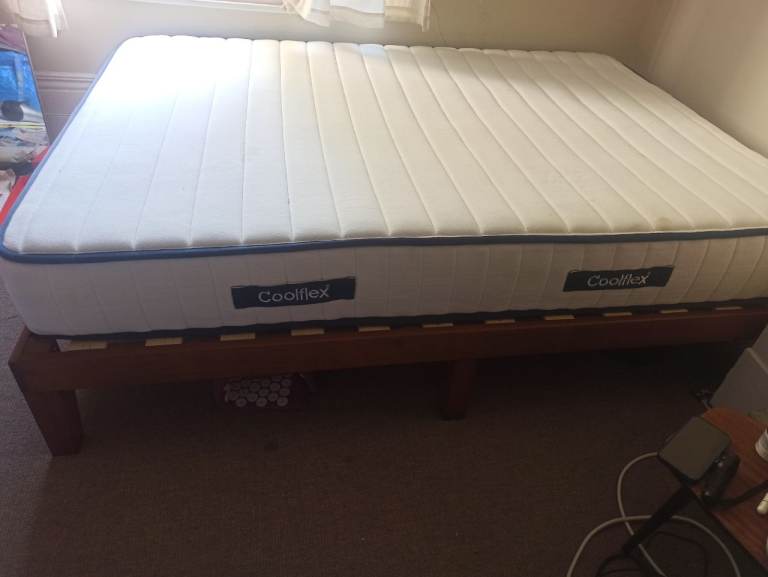 Available: Double wooden bed frame & mattress