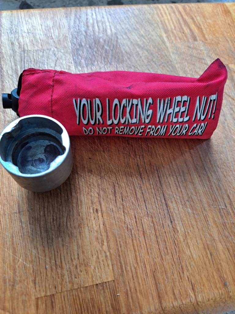 Wheel locking nut removal socket key.