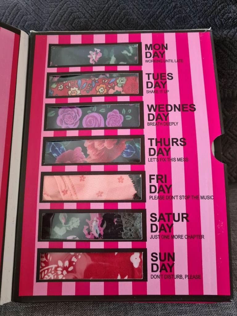 Victoria's Secret "Days of the Week" 7-pack panties set featuring various floral prints, Size S