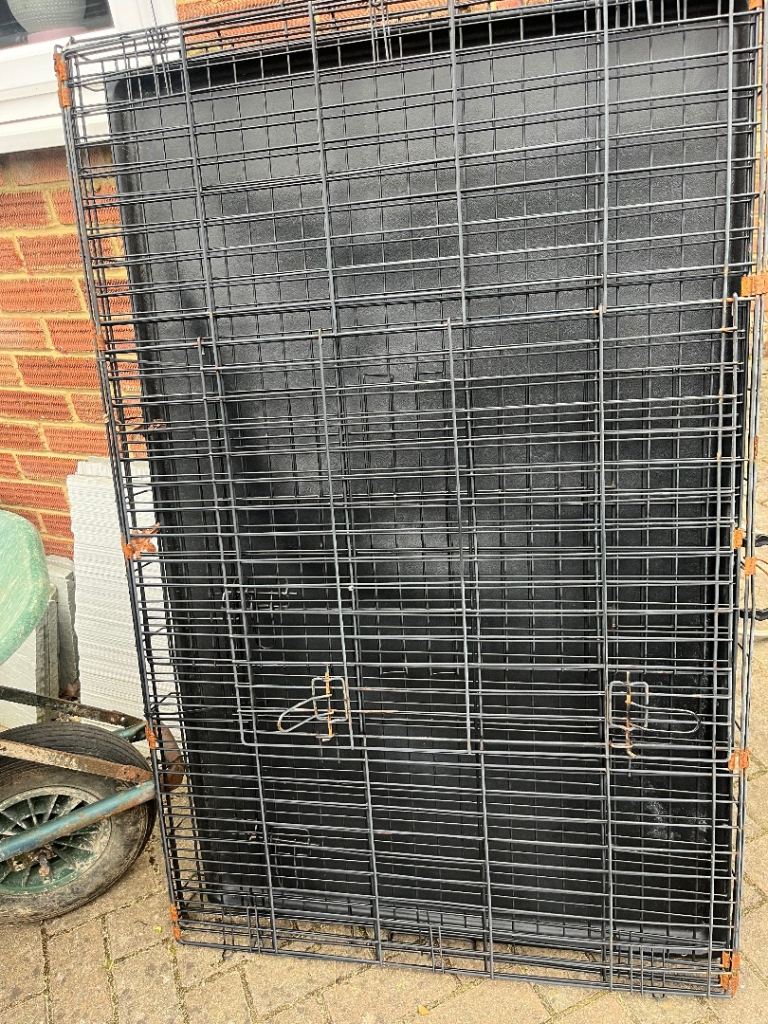 Metal dog cage.  X. X. L.