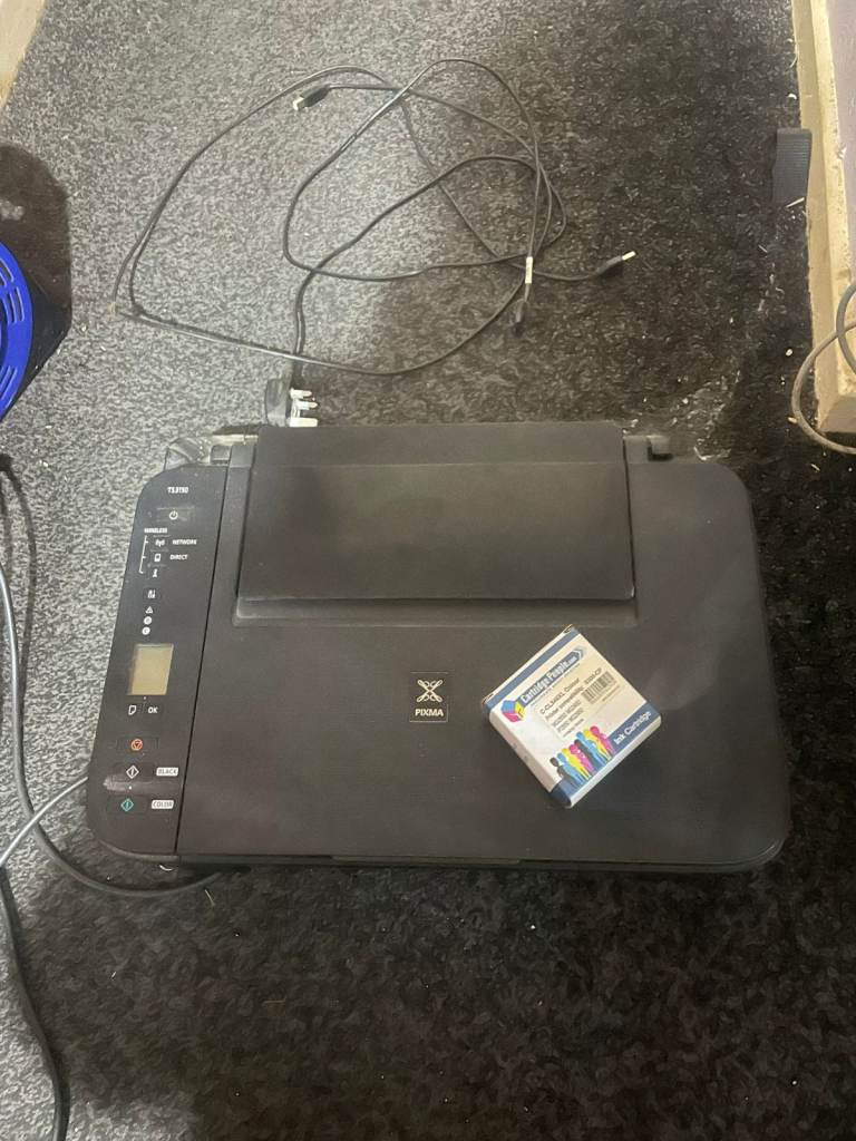 Canon TS3150 printer scanner, new colour cartridge, some ink in printer, currently paper jammed?