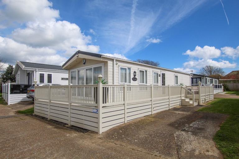 Delta Cambridge 2015 static caravan & deck sited at New Beach, Dymchurch, Kent