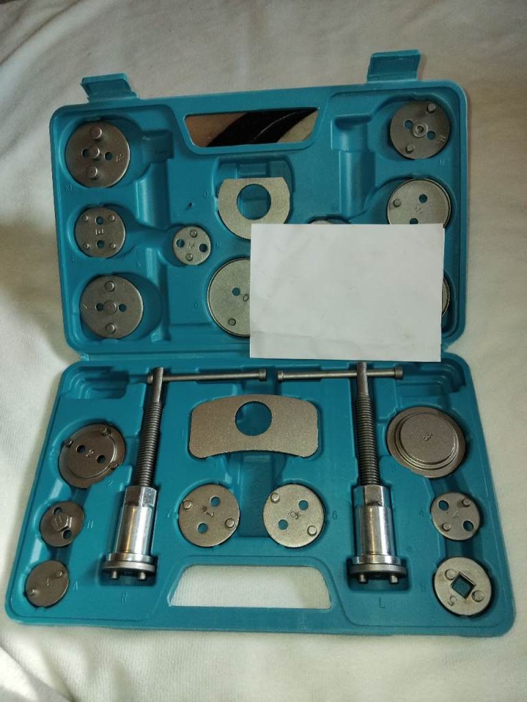 Brake calliper wind back set