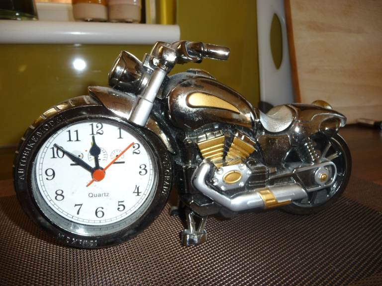 A Plastic Motorbike Ornament with working Clock.