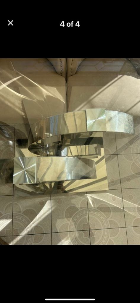 Glass dining room table with silver CC base