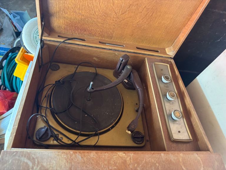 Vintage RCA record player in cabinet