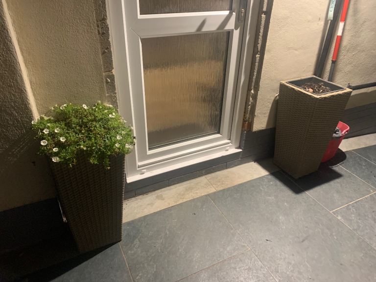 2 tall rattan style planters