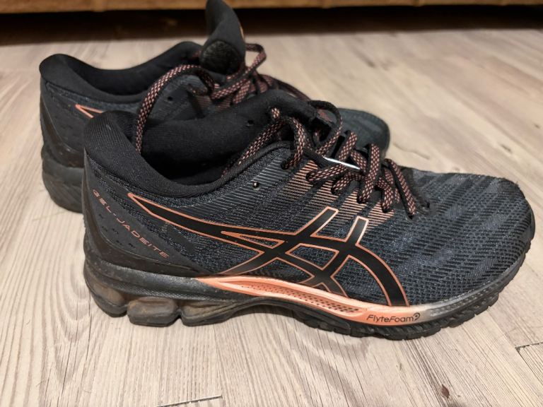 ASICS trainers black gold trim size 4 