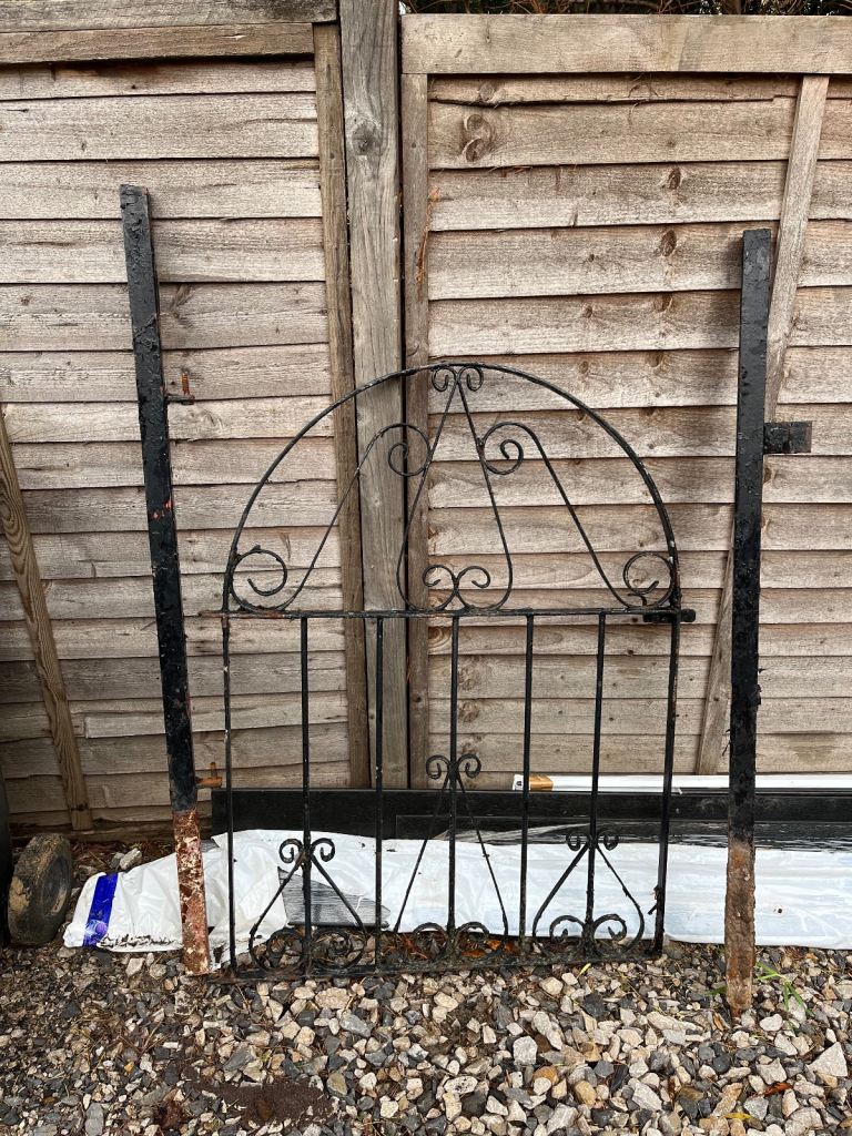Wrought iron garden gate and posts