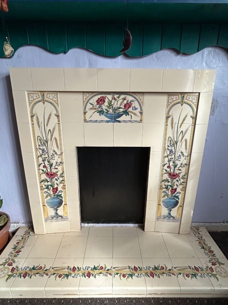 Pretty tiled fire surround and hearth