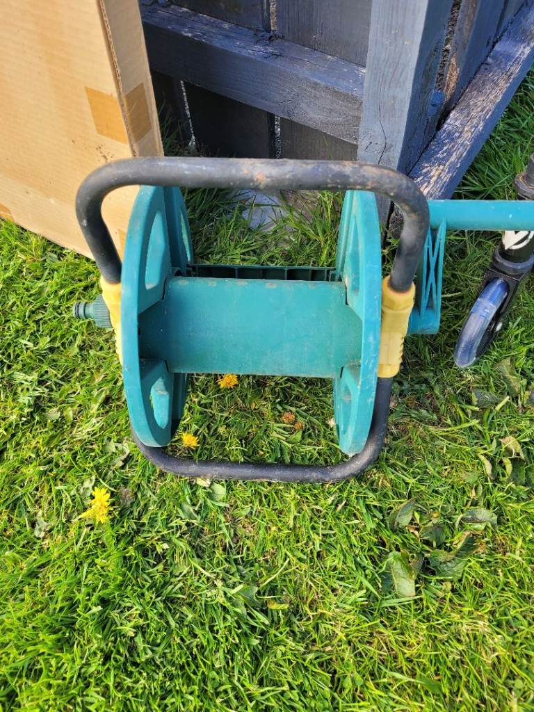 Free garden hose reel/holder