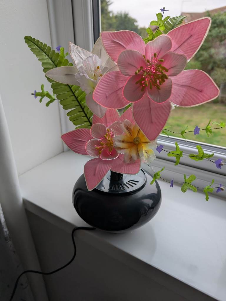 Optic. Light ornament  with silk flowers 