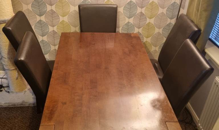 Wooden dining table with 6 chairs