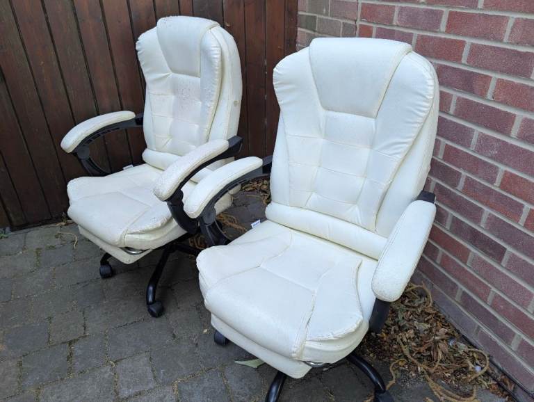 Two office chairs, white, available to pick up from outside my house now.