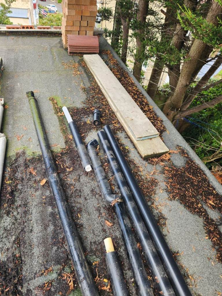 Assorted Black Plastic Drainage Pipes and Connectors – Good Condition