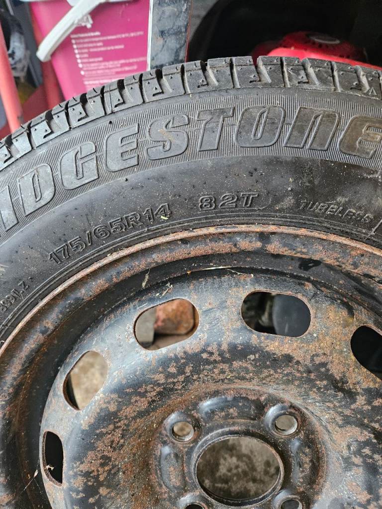 Spare wheel,parcel shelf, jack and brace