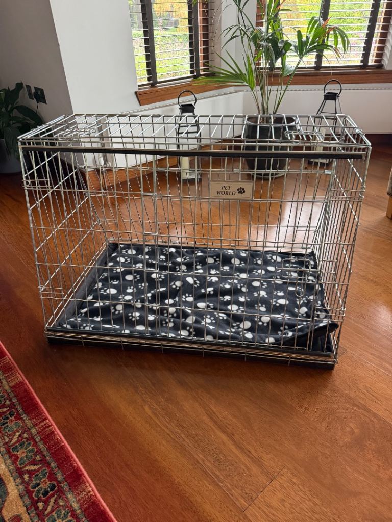Medium sized dog cage for sale. 