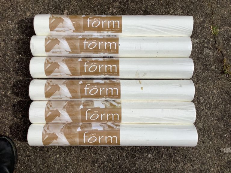 6 Rolls of textured wallpaper in original packaging.