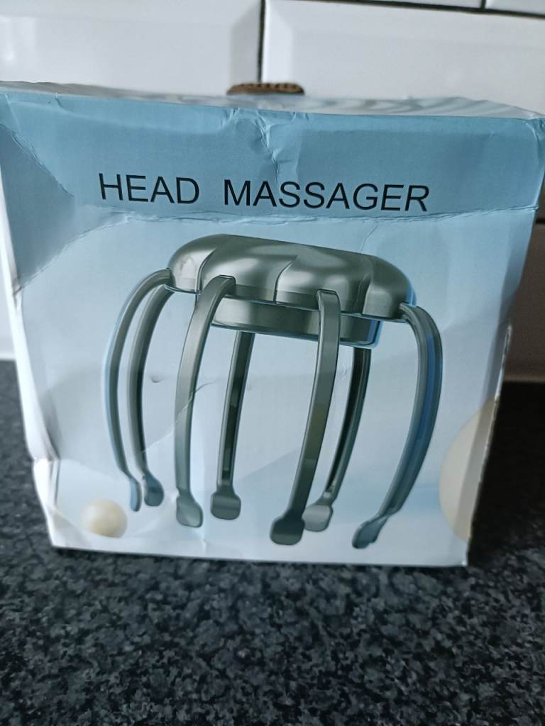 New in box USB head massager with instructions.
