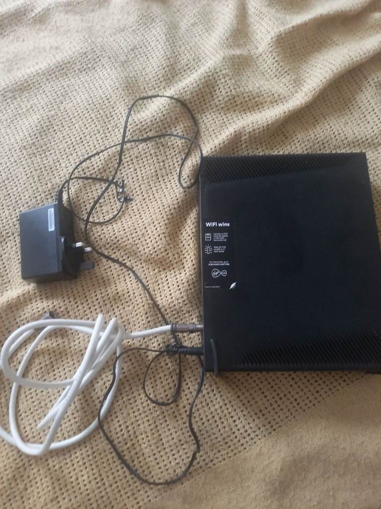 Black WiFi Router with Power Adapter and Ethernet Cable