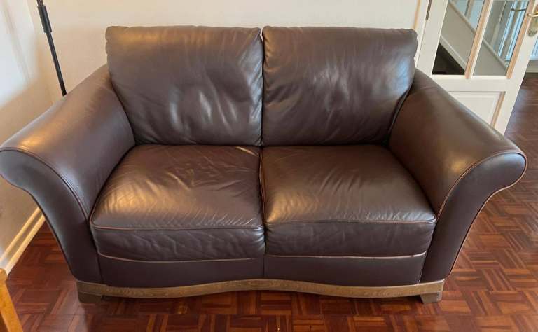 Two seater leather couch Collect Only.