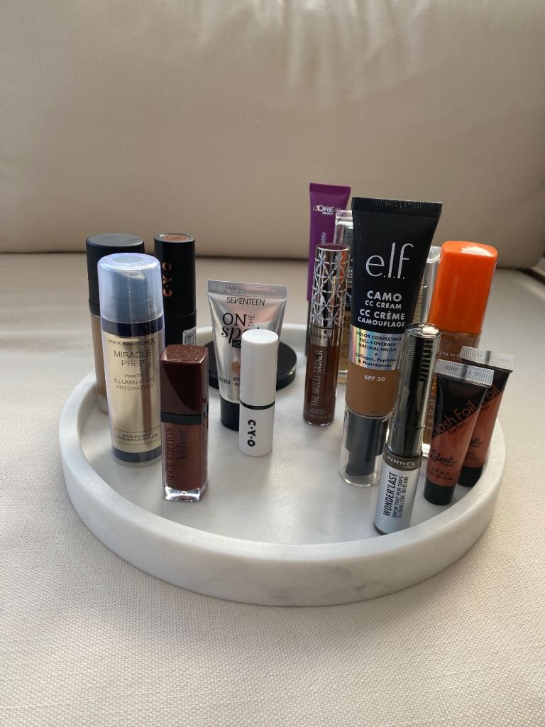 Selection of dark shades make up cosmetics bundle