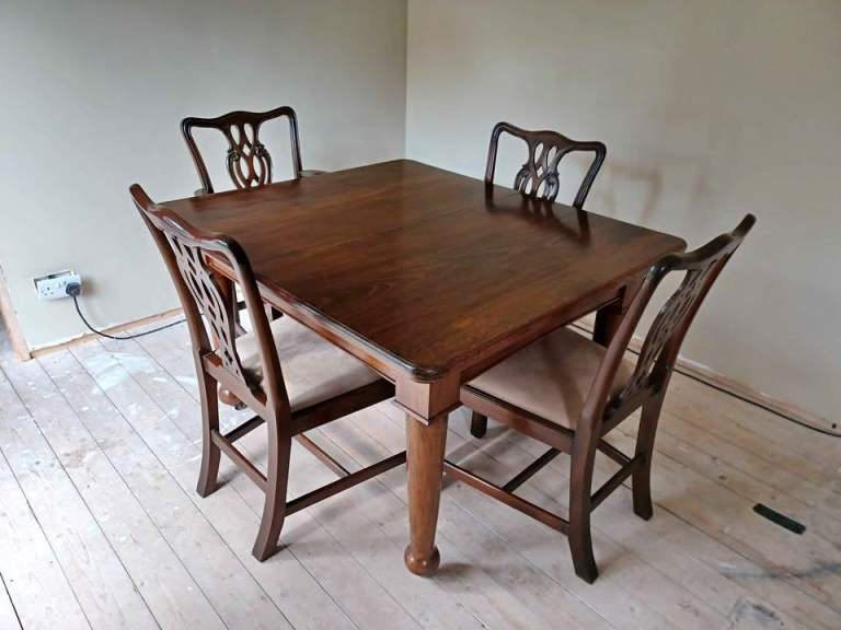 Vintage solid wood extending dining table and 4 Chippendale replica chairs
