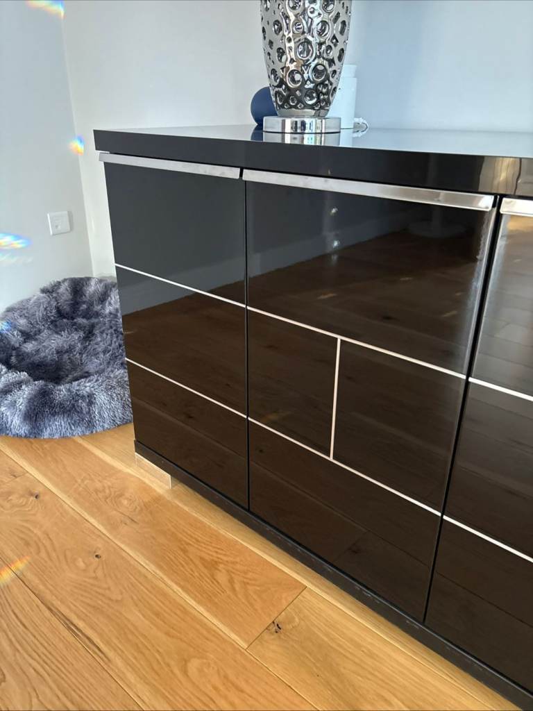 Black high gloss side board. 