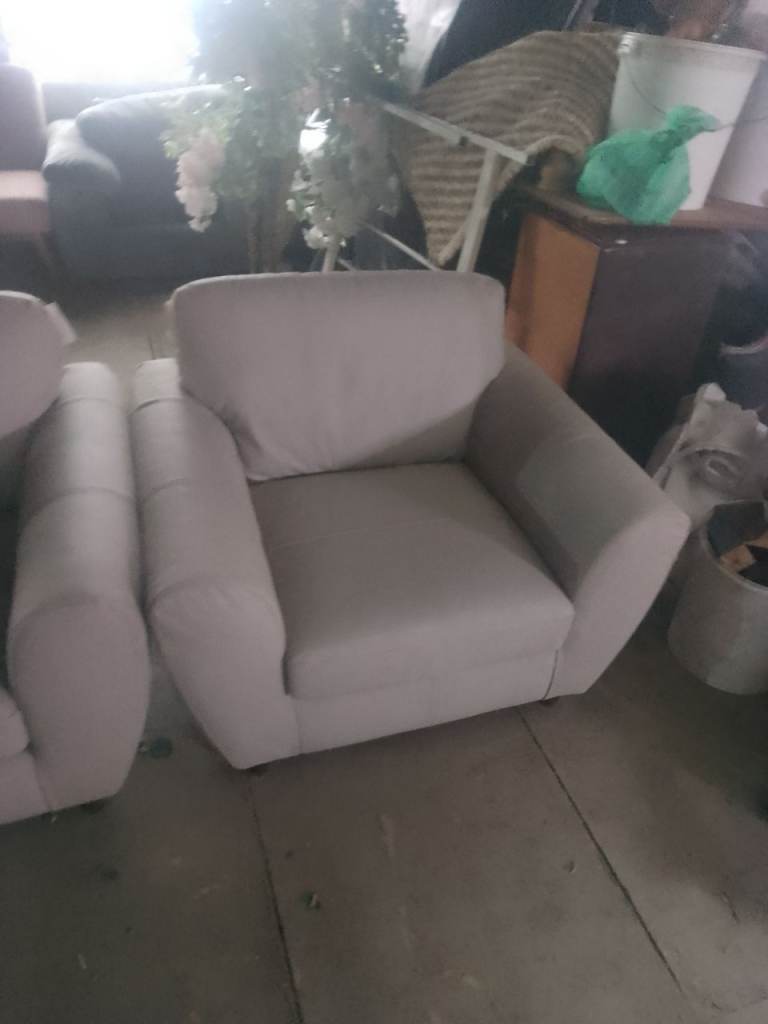 Ex display 2x matching armchairs in light grey leather only £100